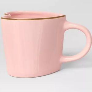 Stunning pink heart shaped mug with gold trim.